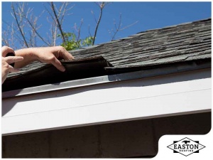 Whether your roof is approaching the end of its life or you have noticed warning signs of roof damage, you will eventually need a roof inspection. When you call on a team of roofers to diagnose what is causing you trouble, you need to know what questions to ask. To get you started, Easton Roofing, one of the premier commercial roofing contractors in the area, lists five of them here.   1. How old is the roof?  If you purchased your house from the previous owner, you may not know exactly how old the roof is. Because an average asphalt shingle roof can last between 20 to 30 years, depending on the quality of materials used and maintenance performed, you will be able to determine when you are likely to require a full-on roof replacement.  2. Is the ventilation system in good condition?  Attic ventilation is incredibly vital to the health of the roof. It lets out excess moisture and allows fresh air to circulate in the space. If the ventilation is not sufficient or has deteriorated, you may be facing a number of moisture-related problems such as mold and mildew. Ask the residential and commercial roofing specialist if the ventilation is holding up or in need of professional attention.  3. Are there issues that need to be addressed immediately?  After the inspection, the roofer will provide you with a detailed report of their findings. If there are issues that need to be attended to such as curling shingles or loose flashing, they will recommend proper and long-term solutions so you can protect the rest of your home.  4. How will the yard be protected from damage?  If you go forward with roof repair or replacement, you will need to inquire about the safety precautions to be observed in order to protect your backyard or landscaping. A reliable roofer will secure ladders to protect your gutters, cover your flower beds and other landscaping features and use dumpsters to minimize the mess.  If you are looking for exceptional “roofers near me reviews” turn to Easton Roofing. Whether you need to repair a storm-damaged roof or replace an aging roof, our team can deliver the outstanding workmanship and personalized customer service you deserve. Call (913) 933-8065 or fill out our convenient online form to schedule an appointment.